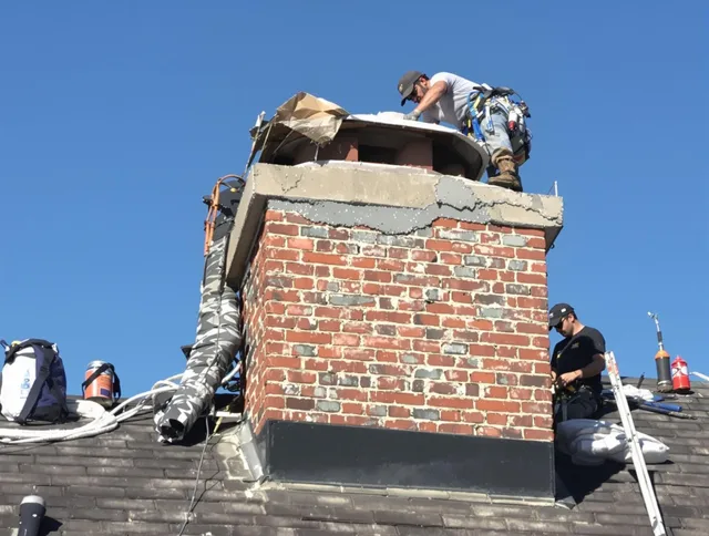 Ocala Chimney Sweep installing a custom chimney crown in Ocala, FL