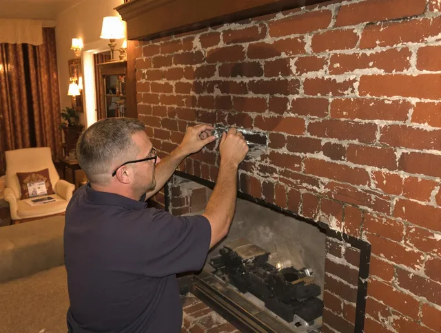 Ocala Chimney Sweep expert fixing a fireplace in Ocala, FL